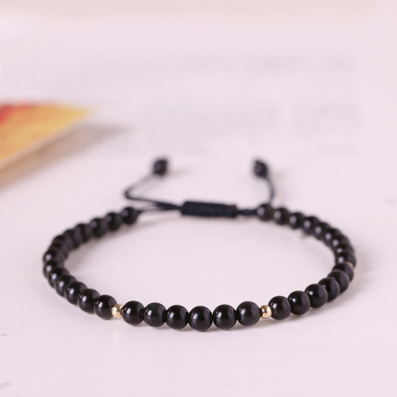 Bracelet en corde avec petites perles d'obsidienne noire Buddha Stones