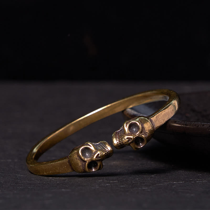 Bracelet manchette en cuivre et laiton avec double tête de mort et Buddha Stones Le Seigneur de la forêt des cadavres
